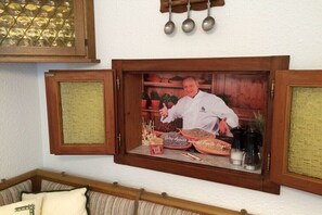 A framed picture of a chef with various food items and kitchen utensils. - Holiday apartment with 2 bedrooms (Reit im Winkl)