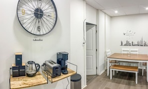 A modern kitchen with a coffee maker, toaster, and kettle on a wooden countertop. - 20 Minutes to MetLife Stadium / Manhattan / FIFA 2026 (Apt. 2) (West New York)