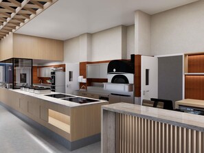 A modern kitchen with a central island, built-in appliances, and a large oven. - Ibis Almaty East (Opening Autum 2026) (Almaty)