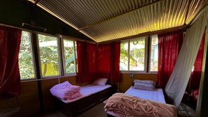 A room with two beds, a window, and a curtain. - Hotel Forestway Hostel and Backpackers (Pokhara)