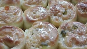A tray of baked goods arranged in rows.