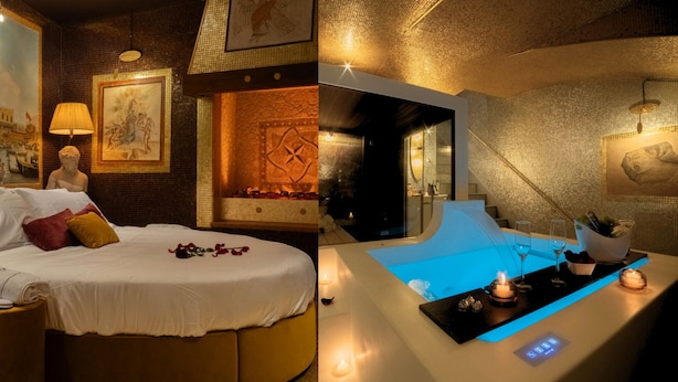 A luxurious hotel room with a bed, a bathtub, and a dining area with a table and chairs. - The Doge's Secret | Wellness Suite with Private Spa in Verona (Verona)