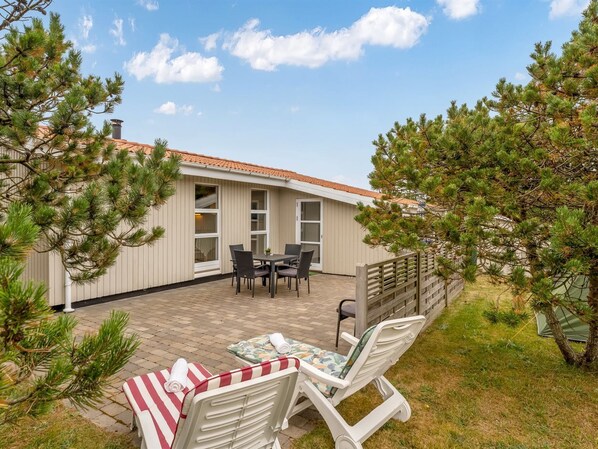 A house with a patio, outdoor furniture, and a view of the sky. - "Jale" - 300m from the sea by Interhome (Thisted)