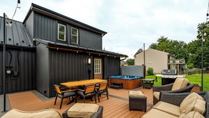 A deck with outdoor furniture, a hot tub, and a barbecue grill. - Lantz Retreat  Hot Tub • Spacious Deck (Lebanon)
