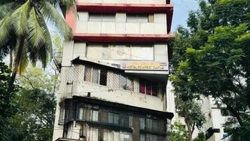 A multi-story building with a restaurant on the ground floor.