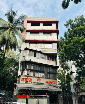 A multi-story building with a restaurant on the ground floor.