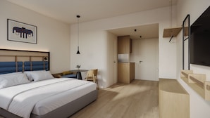 A modern hotel room with a large bed, a desk, a chair, a TV, and a kitchen area.