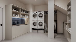 A laundry room with four stacked washing machines, shelves with toiletries, and a tiled backsplash. - Bob W Athens Stadiou (Athens)
