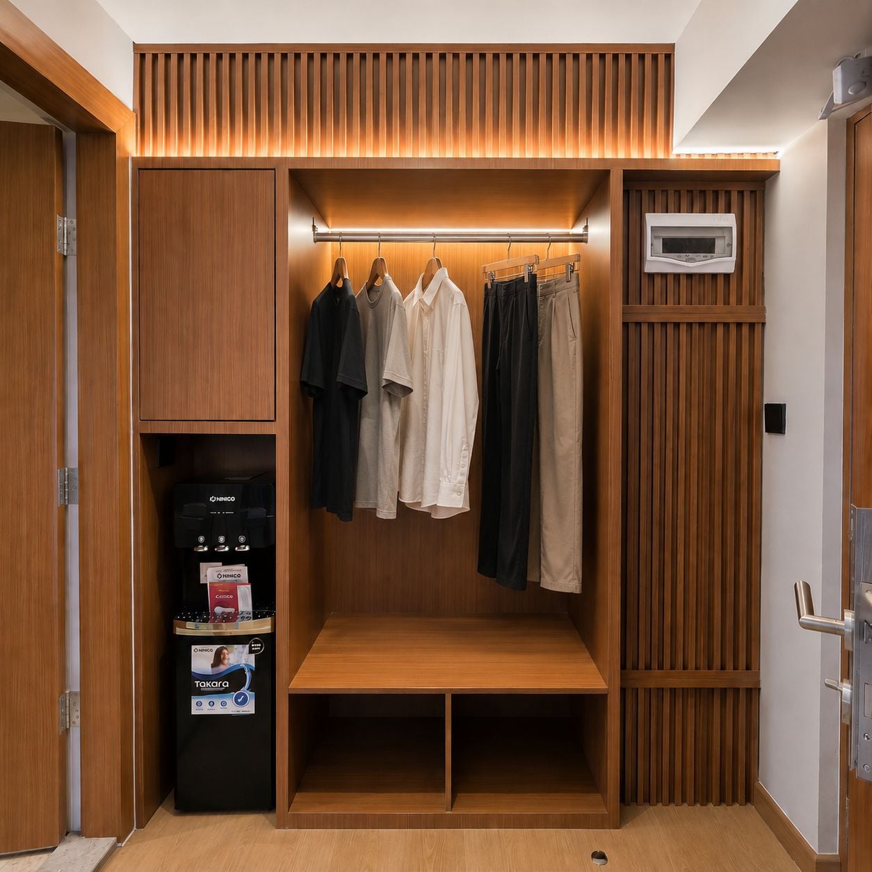 A walk-in closet with wooden paneling, a built-in coffee machine, and a bench.