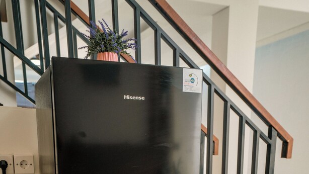 A black refrigerator with a water dispenser and a Hisense logo. - Villa Lopina Umalas (Kuta Utara)