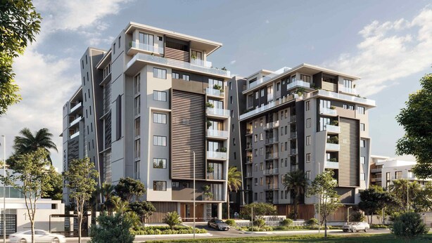 Un moderno edificio residencial de varios pisos con balcones, un jardín ajardinado y cielo despejado.