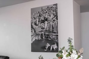 A black and white cityscape artwork on a wall. - Filioque | Mountain View | Parking | Central (Wollongong)