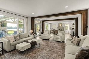 A spacious living area with a fireplace, comfortable seating, and a view of the outdoors. - Welcome to the magic of Langford Creek Farm (Chestertown)