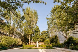A park with benches, a statue, and trees. - A PEACEFUL & REFINED RETREAT IN THE HEART OF THE RIVE GAUCHE – RUE DU BAC (Paris)