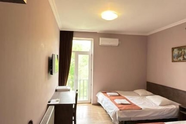 Classic Triple Room, Balcony, Courtyard View | In-room safe, desk, laptop workspace, blackout drapes