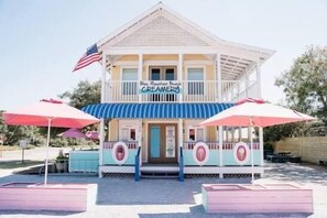 A two-story building with a sign reading 'Blue Mountain Beach Creamery.' - Lucky Snapper - 30A Coastal Retreat with 6-Seater Golf Cart (Santa Rosa Beach)