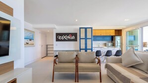 A modern living room with a flat-screen TV, a sofa, and two armchairs. - Apt w/ Balcony, BBQ & sea View Shc0801 (Picarras)
