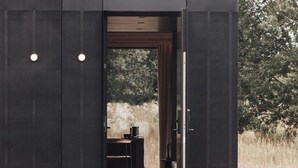 A modern, dark-toned building with a doorway leading to an interior space. - Wilsumer Berge Resort- Nokken Forest Cabin by Interhome (Wilsum)