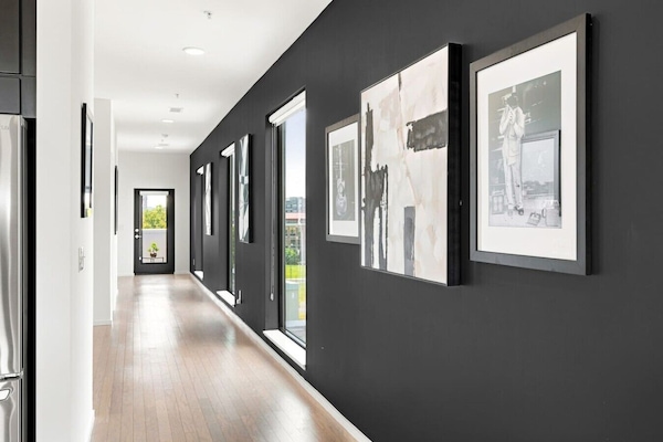 Spacious hallway leading to the second private balcony and bedrooms.