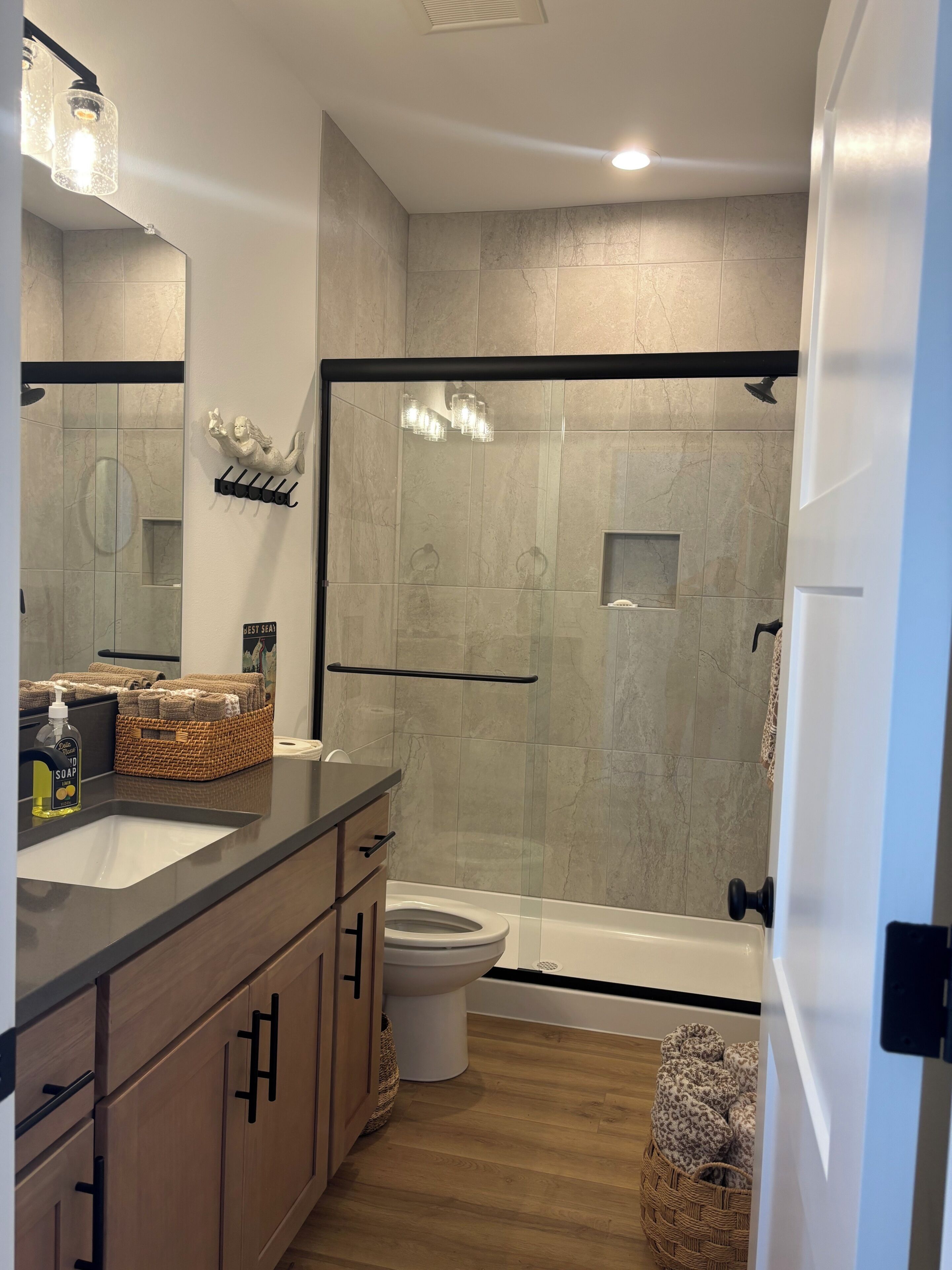 Shower, hair dryer, towels, soap