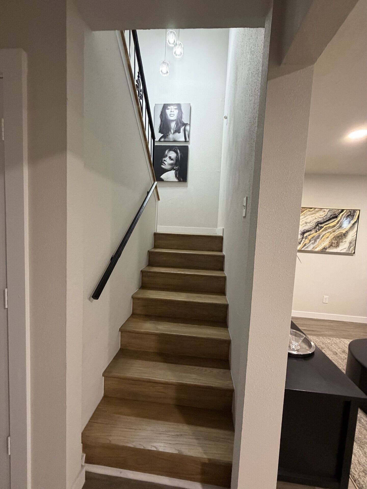 A staircase with wooden steps leading to a landing.