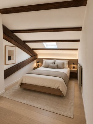 A bedroom with a sloped ceiling, a skylight, a bed with a headboard, bedside tables with lamps, and a radiator. - Villa des Vignes in Cabrials – private pool in the heart of the vineyards (Beziers)