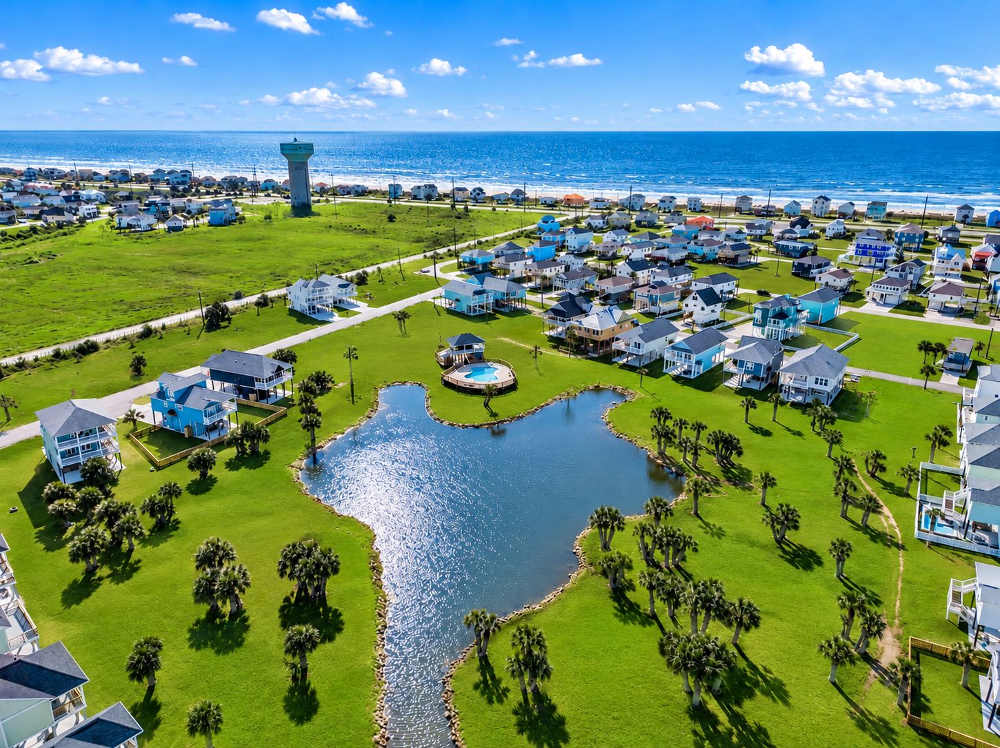 A coastal residential area with houses, a central water feature, and a lighthouse.
