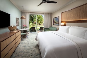 A hotel room with a bed, a television, a desk, a chair, and a view of the outdoors. - Sold‑Out Valentine’s Week – Westin Princeville King Studio Villa with Balcony (Princeville)