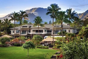 A resort with multiple buildings, palm trees, and a mountainous backdrop. - Sold‑Out Valentine’s Week – Westin Princeville King Studio Villa with Balcony (Princeville)