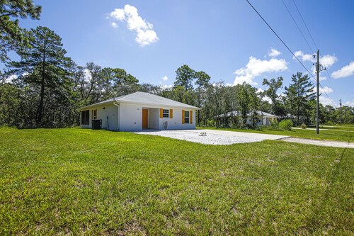 Rare alternative to the typical home on a small lot, this is true Florida living