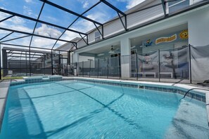 An indoor swimming pool with a glass ceiling, a children's play area, and a sign that reads 'sunshine wishes.' - Enchanted Escape Villa (Davenport)