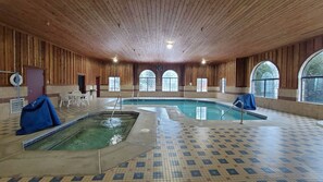 An indoor swimming pool with a tiled floor and wooden walls. - King Room Getaway Near Tawas Bay with Easy Access to Lake Huron (Tawas City)