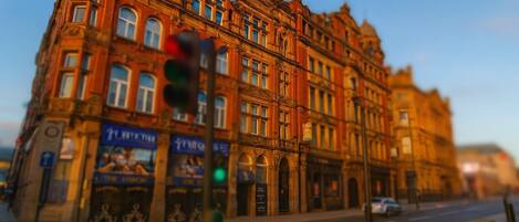 A historic building with multiple stories and ornate architectural details.