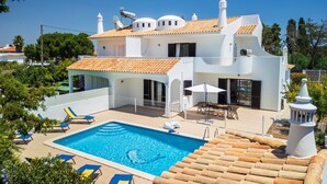 A two-story house with a swimming pool, outdoor furniture, and a white fence. - CAJI- NEW VILLA NEAR THE BEACH (Albufeira)