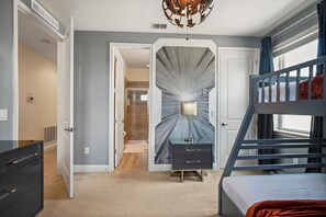 A bedroom with a bunk bed, a desk, and a wardrobe. - 5 BD/ 5 BA/ Encore Resort at Reunion (280 PC) (Kissimmee)