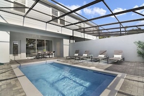 A swimming pool with lounge chairs and a patio area. - 5 BD/ 4.5 BA/ Windsor Island (131 JW) (Davenport)