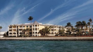 A multi-story hotel with balconies, located near a body of water. - Family Friendly, Oceanside 2BR 2BA Condo - Hyatt Vacation Club Windward Pointe (Key West)