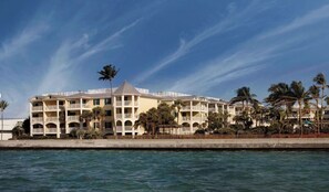 A multi-story hotel with balconies, located near a body of water. - Family Friendly, Oceanside 2BR 2BA Condo - Hyatt Vacation Club Windward Pointe (Key West)