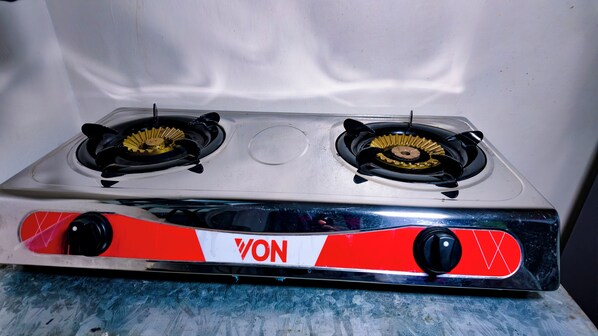 A stove with two burners and a control panel.