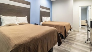 A hotel room with two beds, a desk, and a chair. - Work, Rest & Recharge Near Pasadena l 2 Queen Suite w/ Kitchen (Deer Park)
