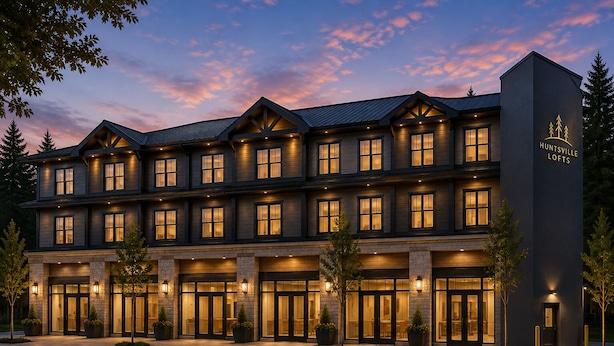 A multi-story hotel with a dark facade, illuminated windows, and a sign reading 'HUNTSVILLE LOFTS'. - Huntsville Lofts (Huntsville)