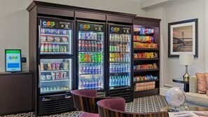 A hotel lobby with a grab-and-go beverage station, seating area, and a framed picture on the wall. - Union Square San Francisco 1BR Deluxe Suite – Club Wyndham Canterbury (San Francisco)