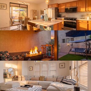A modern kitchen with wooden cabinets, a dining area with glass tables, a fireplace, and a living room with a sofa and blinds. - Phoenix Luxe! Stylish Home! Pool & Hot Tub! Gated community (Phoenix)