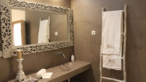 A bathroom with a large ornate mirror, a sink, a towel rack, and a decorative candle. - Terras Agroturismo & Vinhos: Tranquility Among Vineyards for Up to 8 Guests (Beja)