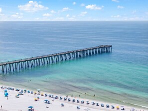 A pier extending into the sea with a beach in the foreground. - 🌊 A Pier Bliss | 3BR Beachfront Condo at Beach Colony Resort (Navarre)