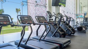 A gym with treadmills, stationary bikes, and dumbbells. - One 1501A Hotel Room: Unforgettable Oceanfront with Endless Views (Puerto Peñasco)