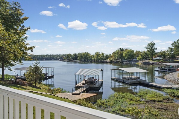A lake with docks and a covered boat ramp.