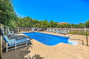 A swimming pool with lounge chairs and a barbecue area. - Family Affair Corolla retreat with private pool, hot tub, and easy beach access. (Corolla)