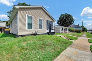 A single-story house with a front porch, a visible number '326', and a well-maintained lawn.