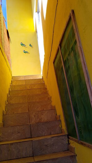 A staircase leading to a room with a window.